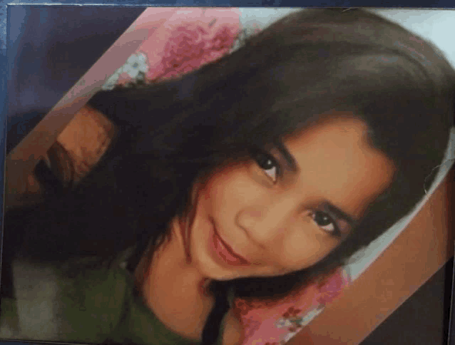 a picture of a young girl with long hair is framed