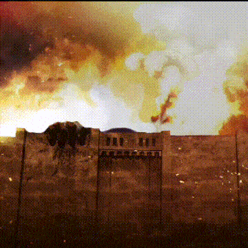 a pixelated image of a building on fire with a sign that says ' a ' on it