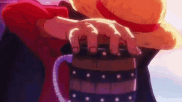 monkey d luffy is holding a barrel in his hand .