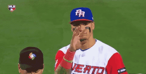 a baseball player wearing a jersey that says puerto rico on it