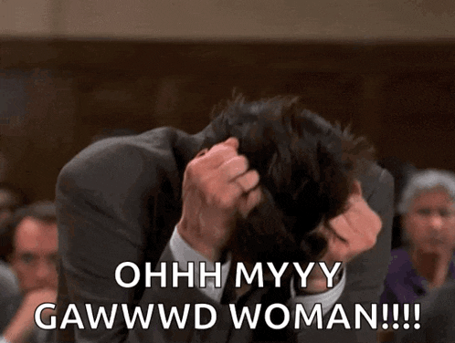 a man in a suit holds his head in his hands and says ohhh myyy gawwwd woman !!!