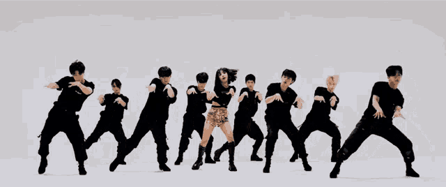 a group of people are standing in a row and one of them is wearing a black shirt with the word army on it