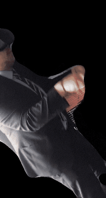 a blurry picture of a man wearing a hat and a jacket