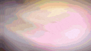 a blurred image of a person 's face with a purple background