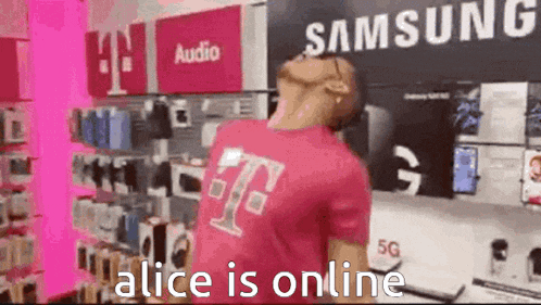 a man in a pink t-mobile shirt is dancing in a store .