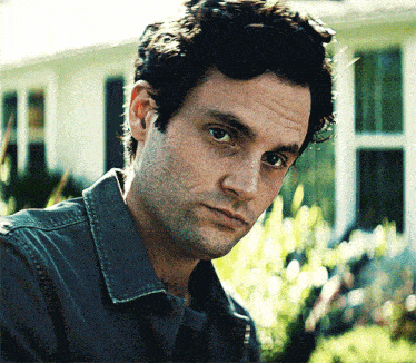 a close up of a man 's face with a serious look on his face