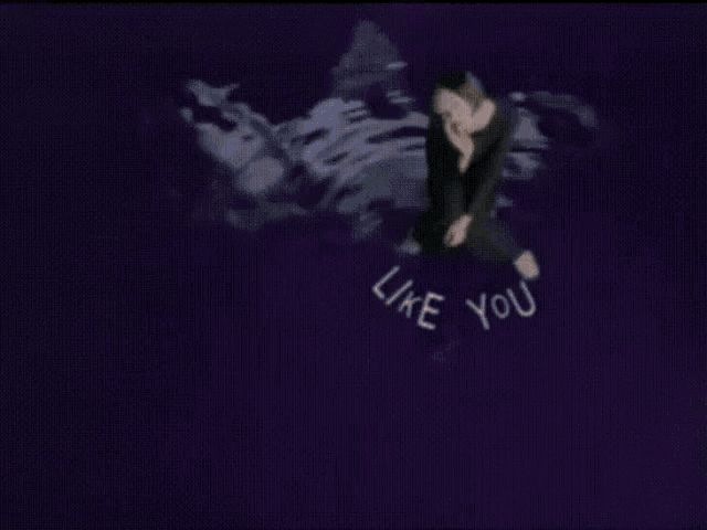 a naked woman with her eyes closed and the words like you behind her