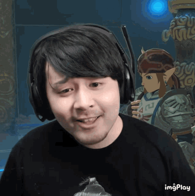 a man wearing headphones with a picture of a video game character behind him and the words imgplay below him