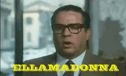 a man in a suit and tie says ellamadonna