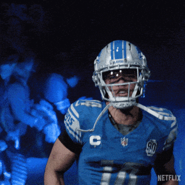 a detroit lions football player wearing a helmet with the number 11 on it