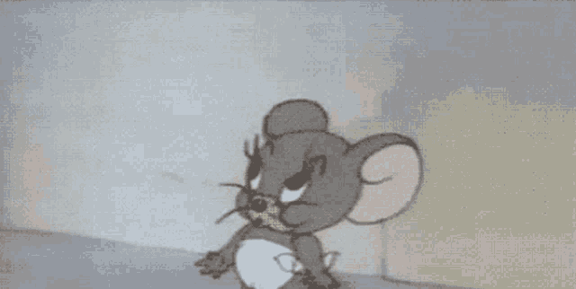a cartoon mouse in a diaper is yawning and looking at the camera .