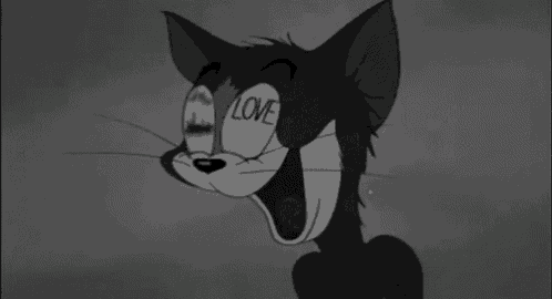 a black and white cartoon cat with the word love written on his face