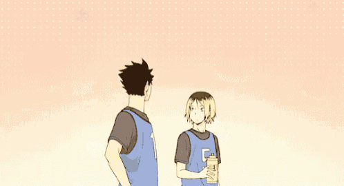 a group of anime characters are standing next to each other . one of the characters is holding a bottle of water .