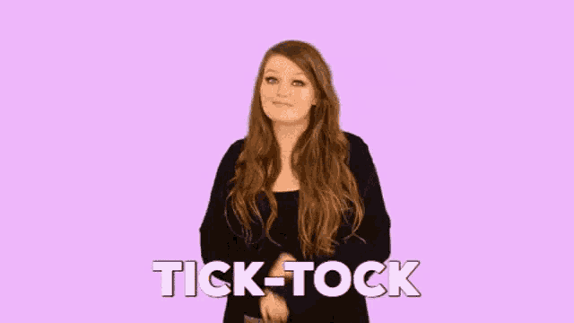 a woman with long hair is making a funny face and says " tick-tock " in white letters