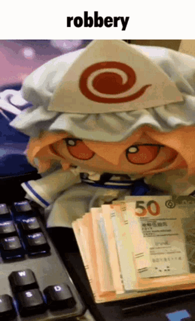 a stuffed doll is sitting next to a pile of money and the word robbery is above her