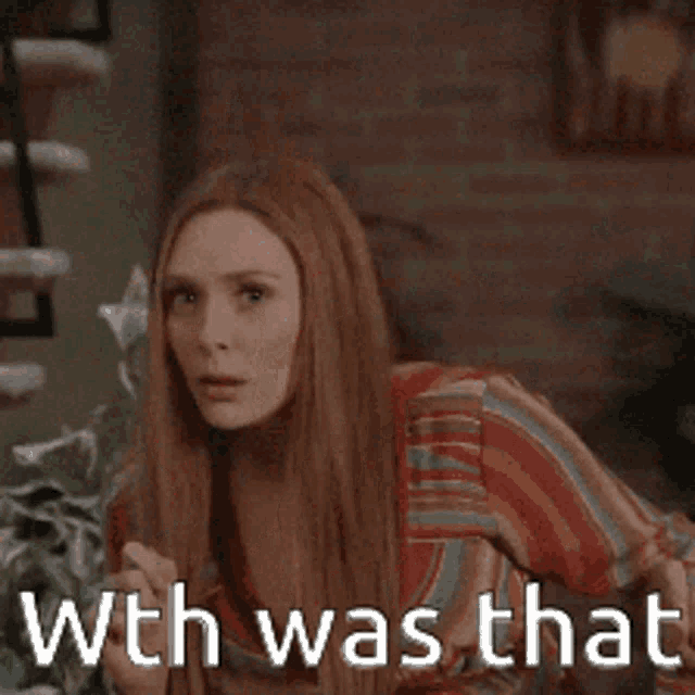 a woman with long hair is making a funny face with the words with was that behind her