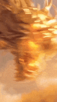 a blurred image of a person 's face with a yellow glow