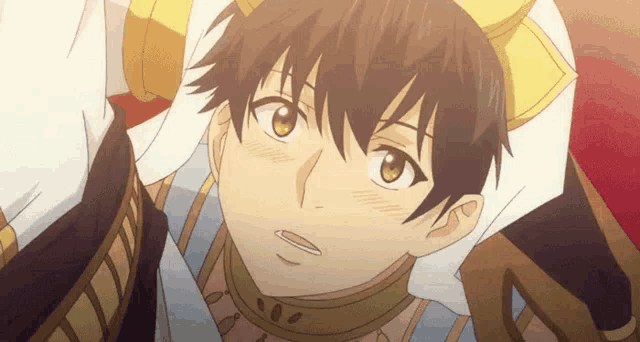 a boy with a crown on his head looks at the camera