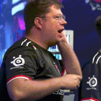 a man wearing a black shirt with the word steelseries on the sleeves