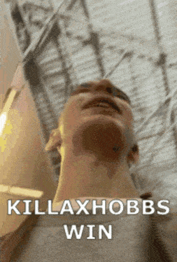 a close up of a man 's face with the words killaxhoobs win written on the bottom