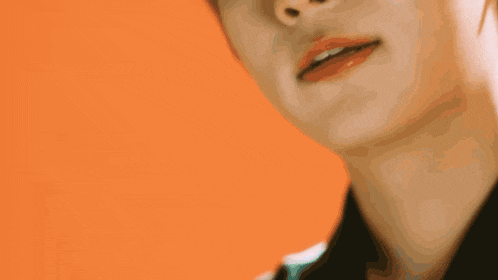 a close up of a person 's face with a yellow background