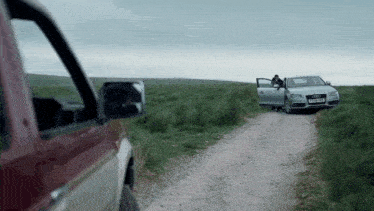an audi is parked on the side of the road