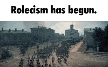 a large group of people are marching down a street with the words rolecism has begun