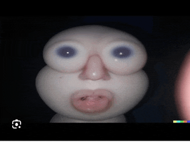 a close up of a doll 's face with big eyes and a pink nose