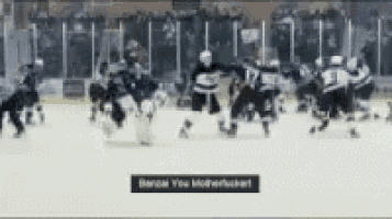 a blurred image of a hockey game with a banner that says barzal you monerluckart