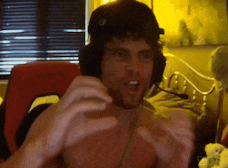 a man without a shirt is wearing headphones and a microphone