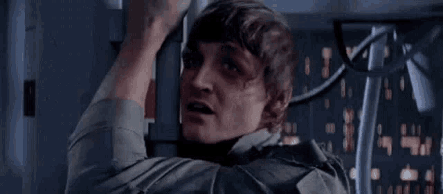a man is holding a railing and saying `` that 's impossible '' .