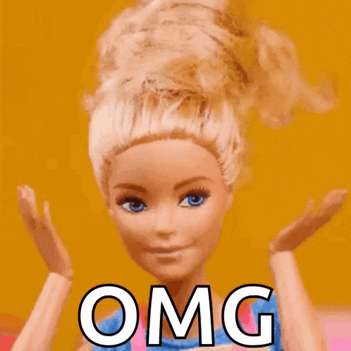 a barbie doll with blue eyes and blonde hair is holding her hands up and says omg