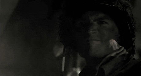 a man wearing a helmet is looking at something