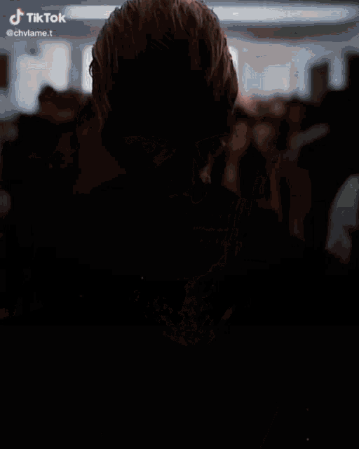 a man with a skull painted on his face looks at the camera with a tik tok watermark