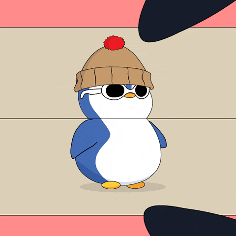 a penguin wearing a hat and scarf is standing next to another penguin