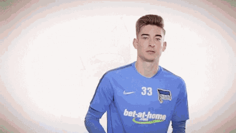 a man is wearing a blue jersey with the number 33 on it