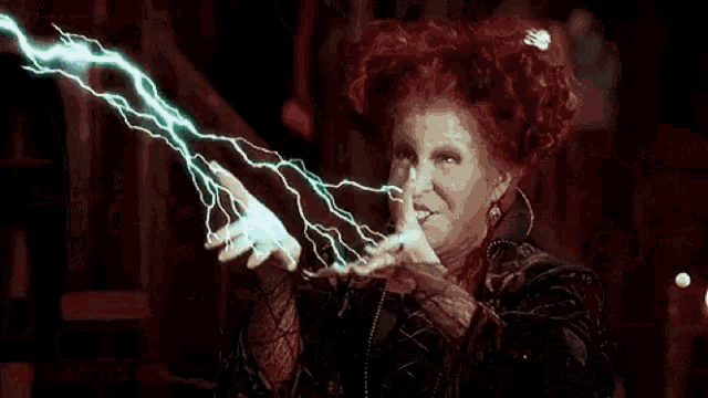 a green lightning bolt strikes a person 's body