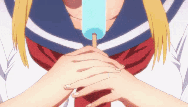 a girl in a school uniform is holding a blue popsicle in her hand