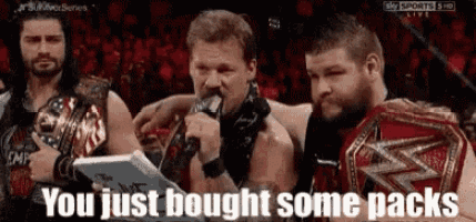 a group of wrestlers standing next to each other with the words you just bought some packs written on the bottom .