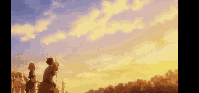 a group of people are standing in front of a sunset with a man riding a horse .