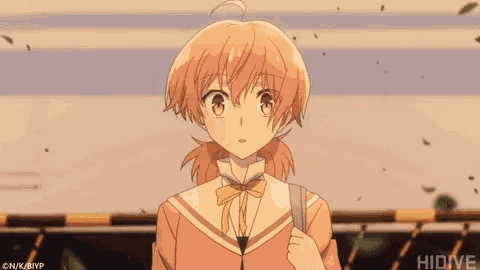 a girl with a ponytail is standing in front of a train with the word hidive on the bottom right