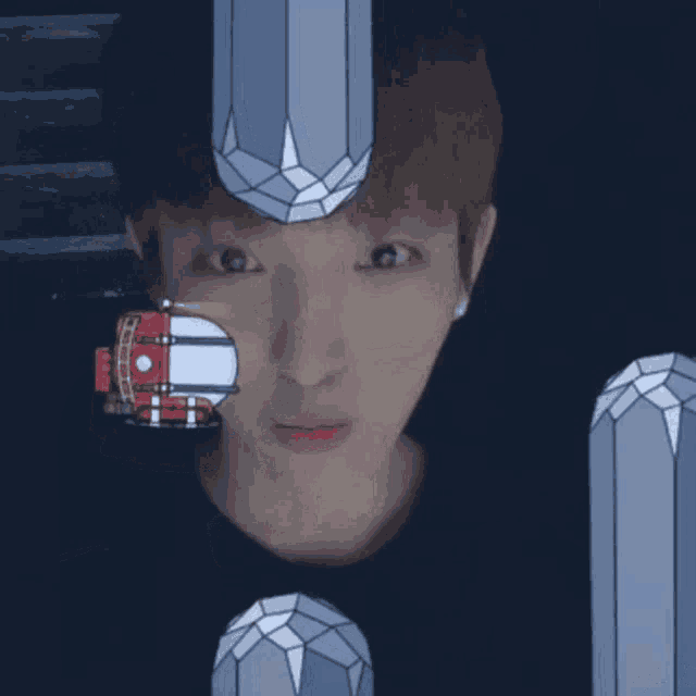 a young man with a drawing of a submarine on his head surrounded by crystals