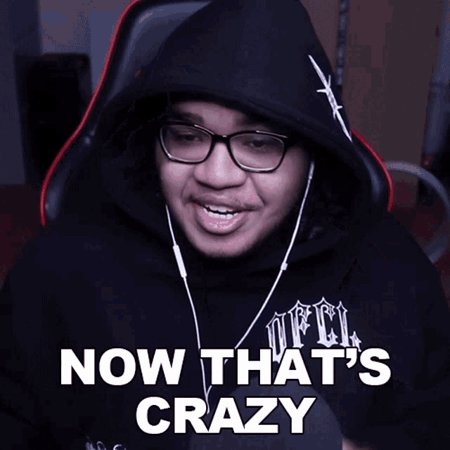 a man wearing headphones and a black hoodie with the words now that 's crazy