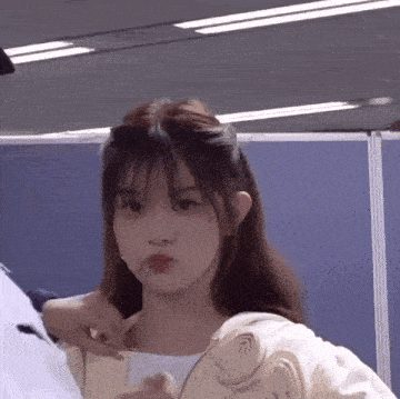 a close up of a girl making a funny face with her mouth open