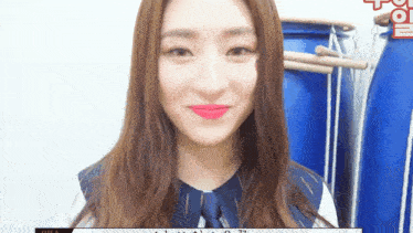 a close up of a woman 's face with red lipstick on