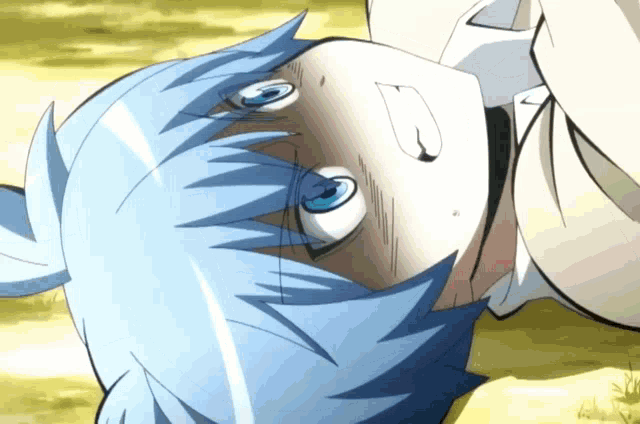 a person with blue hair is laying on their back with their eyes closed