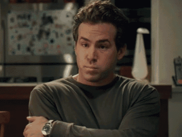 a man wearing a watch is sitting at a table