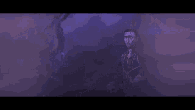 a man and a woman are standing next to each other in a dark room in a purple light .