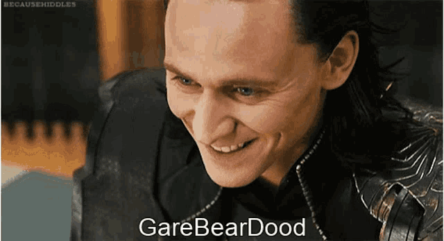 a close up of a man 's face with the words garebeardood on the bottom right