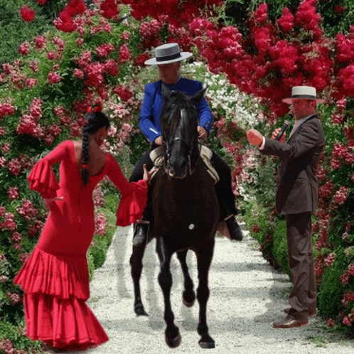 a woman in a red dress is standing next to a man on a horse